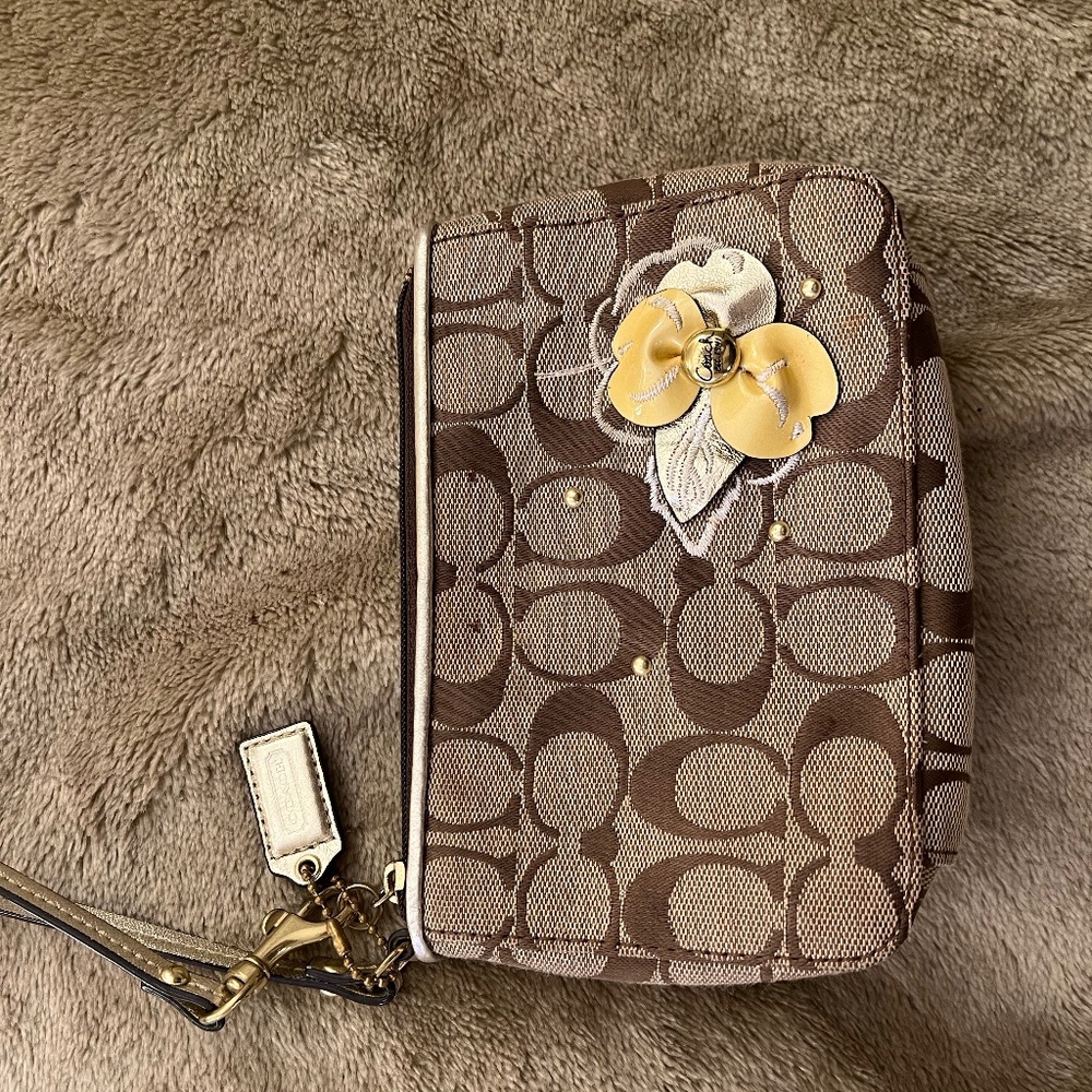 Coach clutch with flower